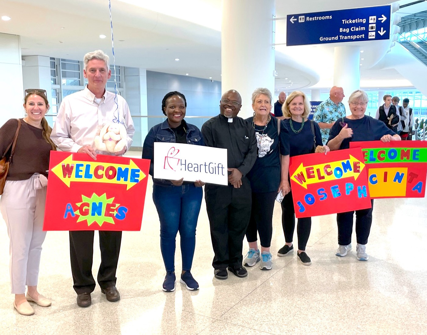 HeartGift volunteers welcome patient at airport